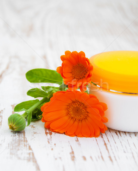 Face cream and calendula flowers Stock photo © Es75