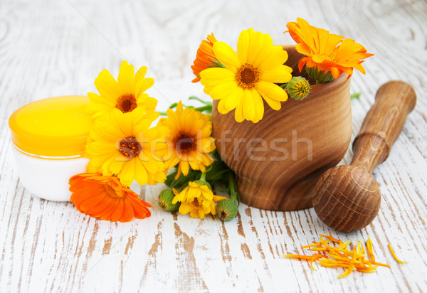 Calendula flowers and mortar Stock photo © Es75