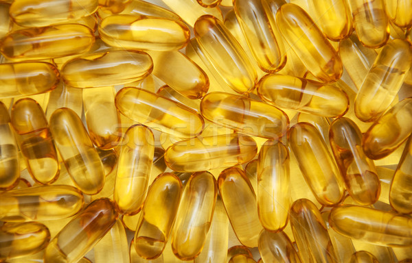 Amarelo pílulas óleo de peixe textura comida Foto stock © Es75