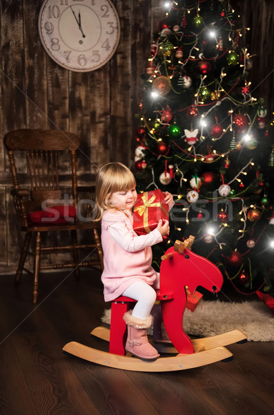 Bambina giocattolo cavallo bella albero di natale ragazza Foto d'archivio © Es75