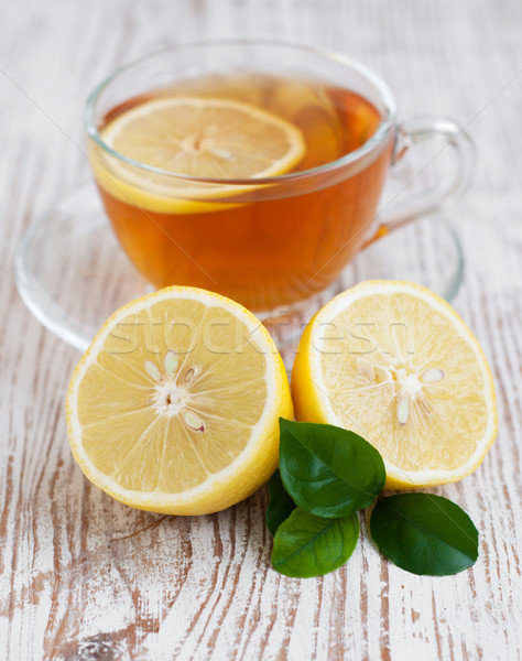 Té taza de té limón mesa de madera hoja Foto stock © Es75