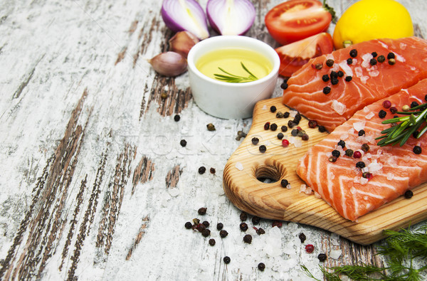 portions of fresh salmon fillet with aromatic herbs, spices and  Stock photo © Es75