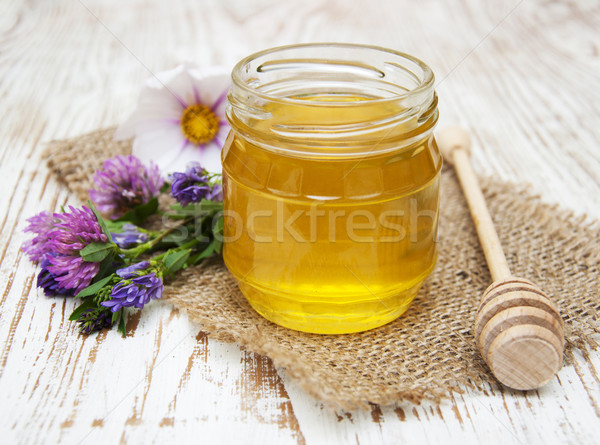 Honey with flowers Stock photo © Es75