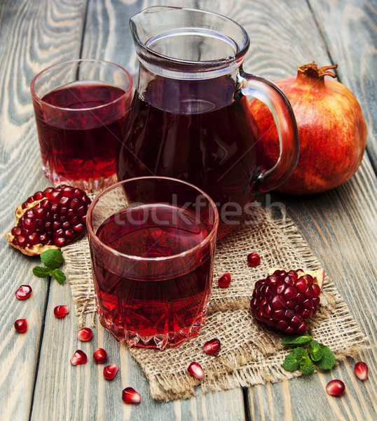 Pitcher and Two glasses of pomegranate juice Stock photo © Es75