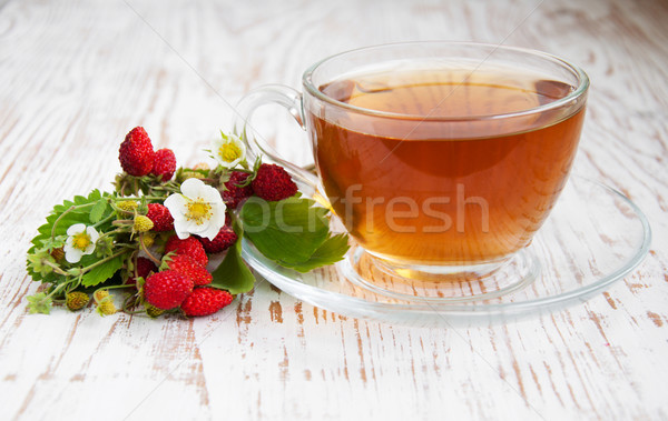 Stock photo: Tea and wild strawberries