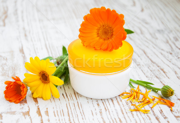 Face cream and calendula flowers Stock photo © Es75