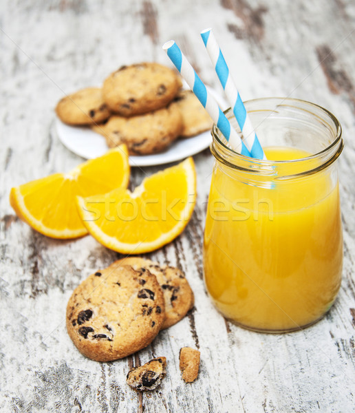 Succo d'arancia vetro fatto in casa cookies legno sfondo Foto d'archivio © Es75