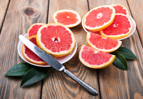 Grapefruits with knife Stock photo © Es75