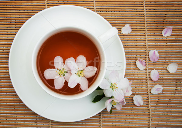 Stock photo: Cup of tea and spring blossom