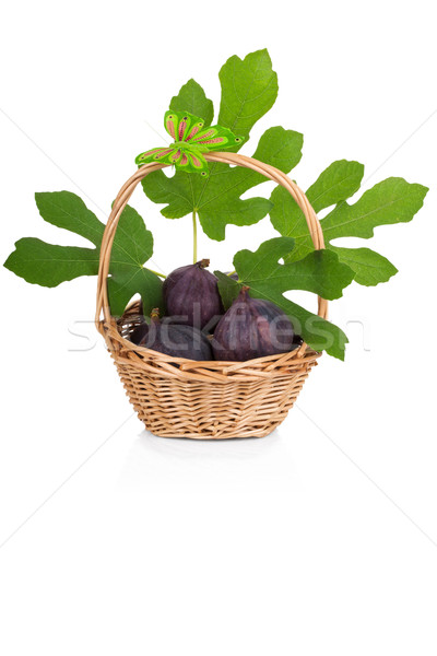 Busket of fresh figs with leaves on white Stock photo © Escander81