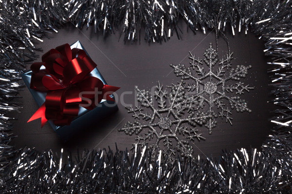 Gift Box With Snowflakes On Wooden Background Stock Photo