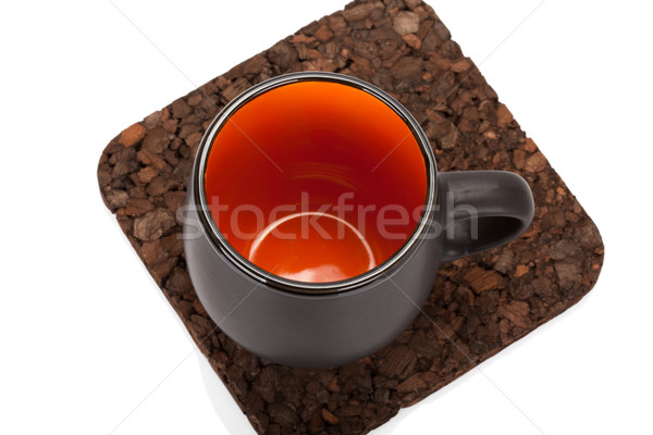 Empty tea cup on wooden table coaster isolated on white backgrou Stock photo © Escander81