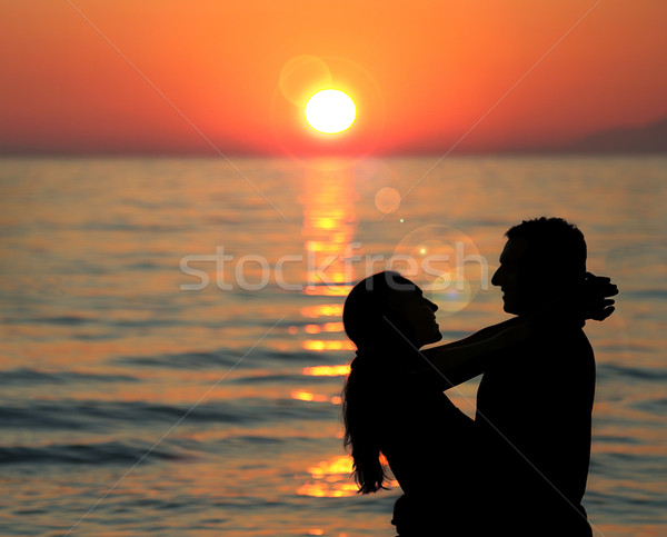 Silhouette of young couple at the sea Stock photo © Escander81