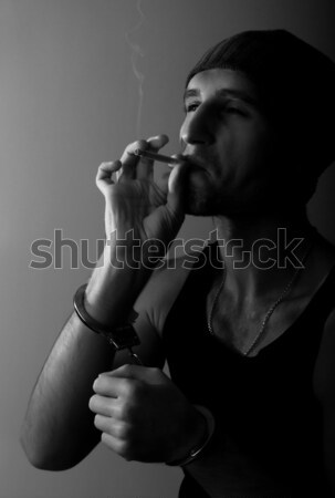 Solitaria giovane sigaretta buio faccia luce Foto d'archivio © evgenyatamanenko