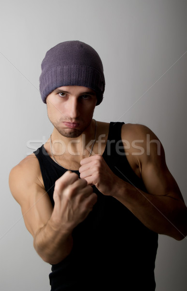 strong man clenched his fists to strike Stock photo © evgenyatamanenko