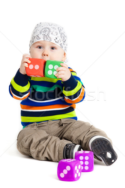 baby is playing with  toys over white background. Funny little k Stock photo © EwaStudio