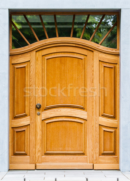 Stock photo: Wooden front door of a home. Old Wooden Door.