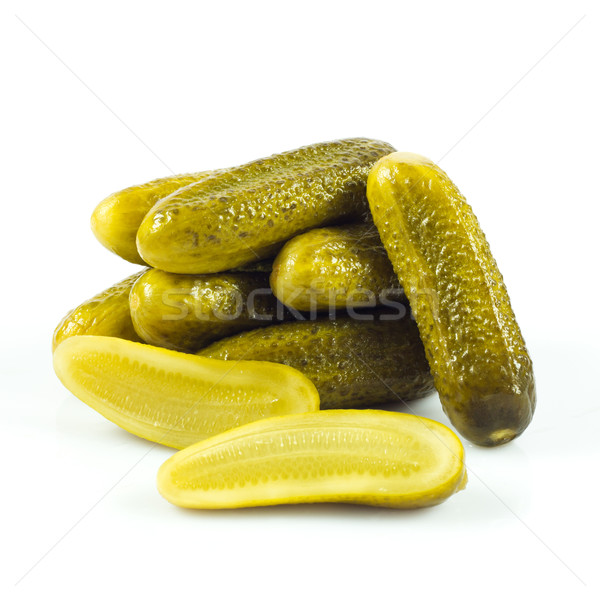 Stock photo: pickled cucumbers. Gherkins on a white background