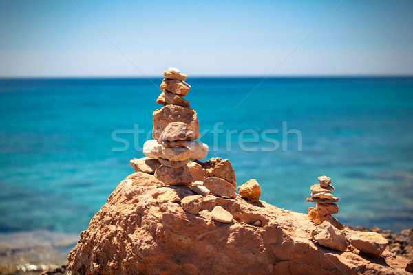 Stock photo: Stones balance, pebbles stack over blue sea