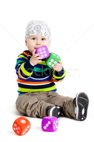 baby is playing with  toys over white background. Funny little k Stock photo © EwaStudio