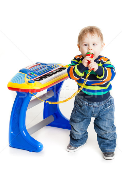 little boy and the keyboard on white background. funny boy baby. Stock photo © EwaStudio