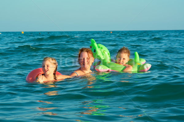 family in the waves Stock photo © fanfo
