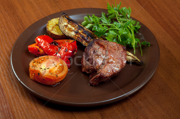 Grilled beef on white plate  with vegetable. Stock photo © fanfo