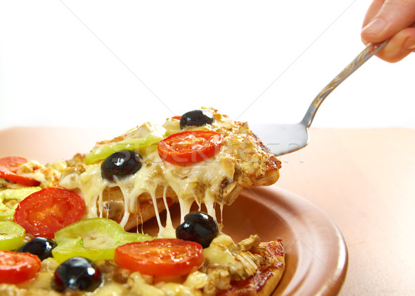Stock photo: taking slice of pizza,melted cheese dripping