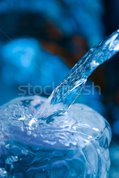 Water being poured into a  glass Stock photo © fanfo