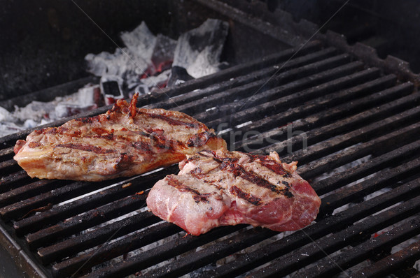 Vesepecsenye steak előkészített barbecue grill sekély tűz Stock fotó © fanfo