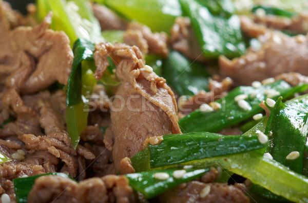 Kínai edény disznóhús zöldségek közelkép piros Stock fotó © fanfo