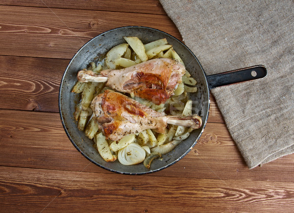 Turkey leg with baked  potatoes  Stock photo © fanfo