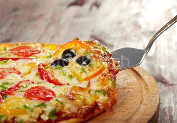 taking slice of pizza,melted cheese dripping Stock photo © fanfo