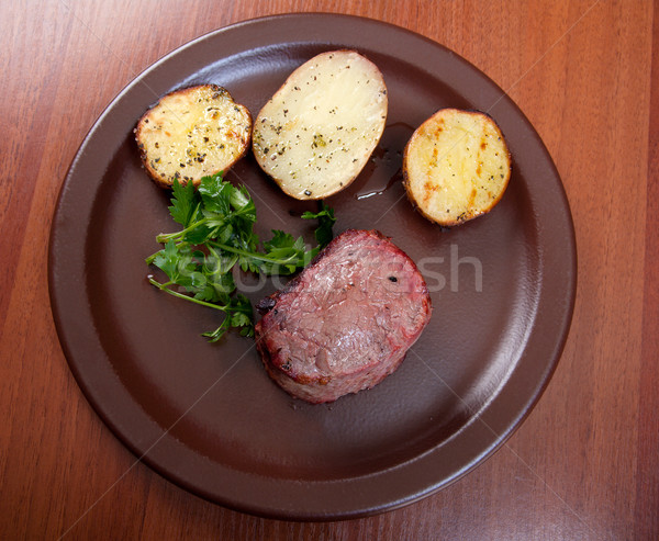 Grilled beef on white plate with potatoes  Stock photo © fanfo