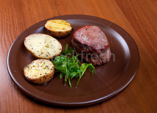 Grilled beef on white plate with potatoes  Stock photo © fanfo