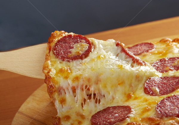Fatto in casa pizza pepperoni fetta formaggio Foto d'archivio © fanfo