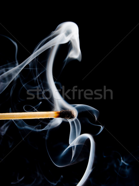 Wooden match burning on a black Stock photo © fanfo
