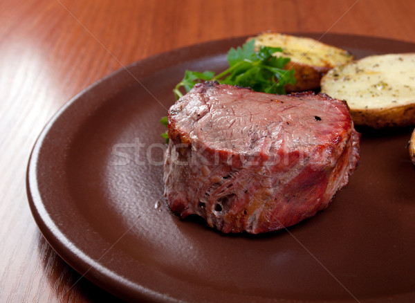 Grilled beef on white plate with potatoes  Stock photo © fanfo