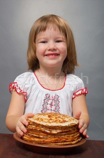 little girl eats pancakes Stock photo © fanfo