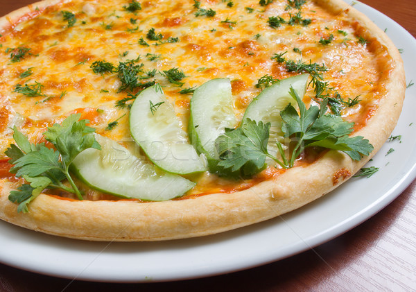Tasty Italian pizza with become cool cucumber Stock photo © fanfo