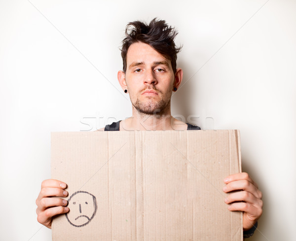 Obdachlosen Mann halten Karton Zeichen Stock foto © fatalsweets