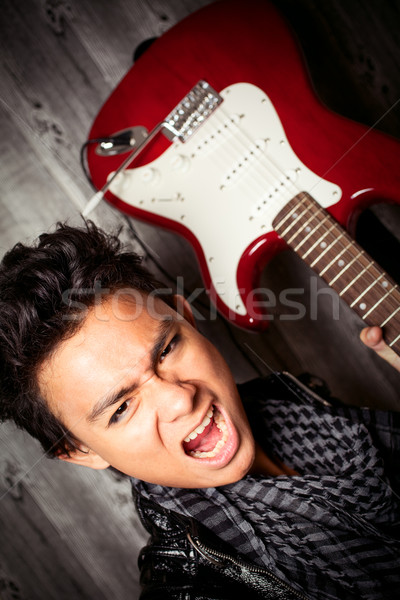 Rock rollen junger Mann Gitarre Stock foto © fatalsweets