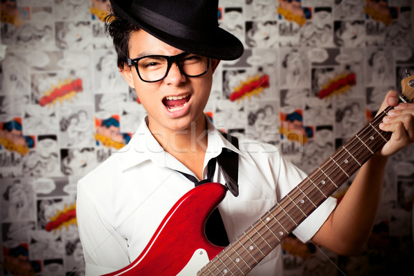 Fiatal zenész fiatalember játszik zene divat Stock fotó © fatalsweets