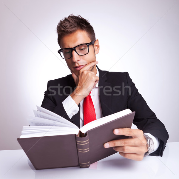 intrigued business man reading a book  Stock photo © feedough