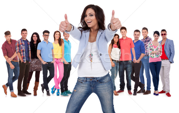 woman making the ok sign in fron of a grouppeople Stock photo © feedough