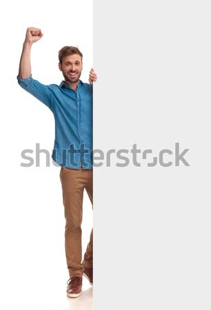 man looks to side walking with hands up  Stock photo © feedough