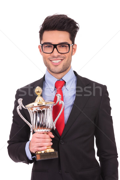 business man holds trophy Stock photo © feedough