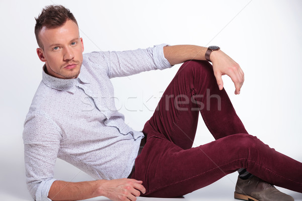 casual man on the floor looks at you Stock photo © feedough