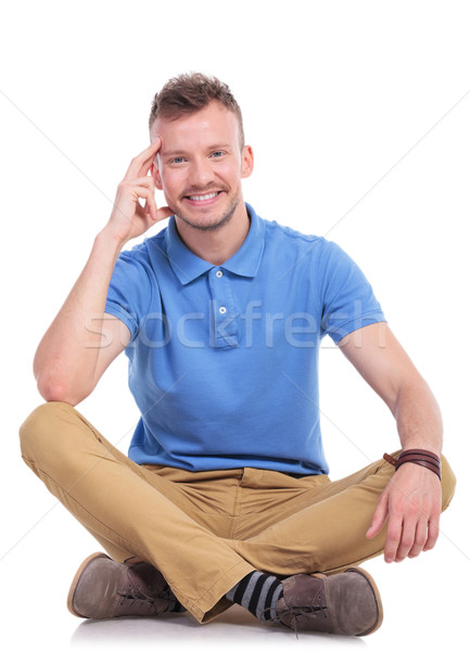 seated young casual man smiles for you Stock photo © feedough