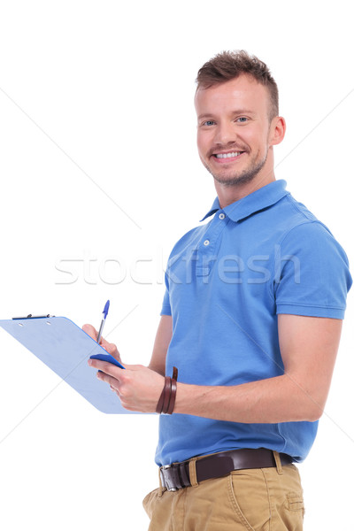 young man fills out a form Stock photo © feedough